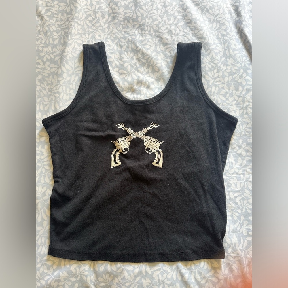 Black tank top with two guns crossed at center